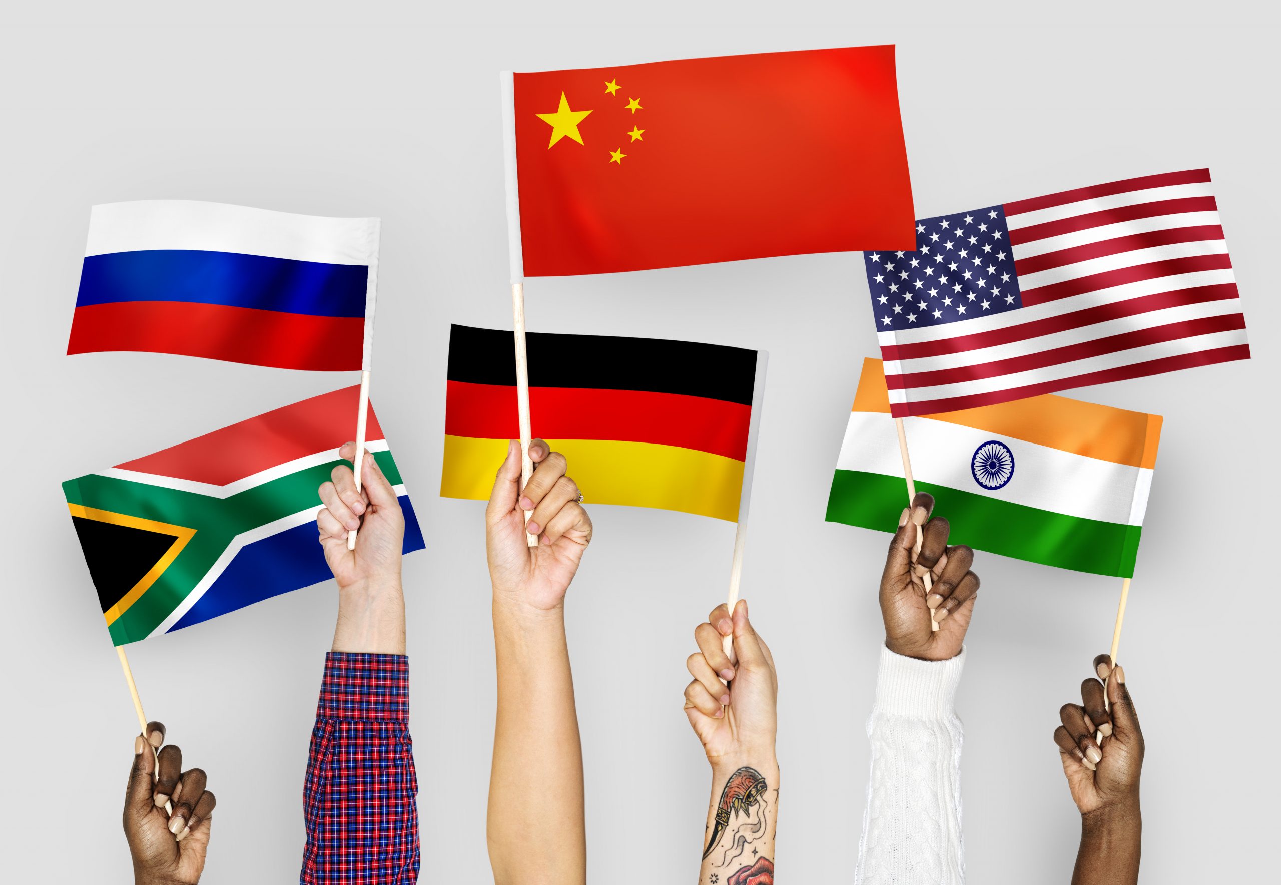 hands-waving-flags-china-germany-india-south-africa-russia-scaled